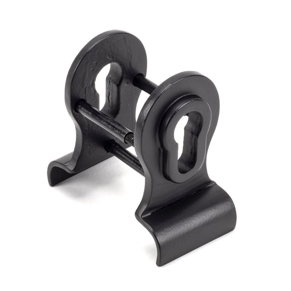 This is an image showing From The Anvil - Matt Black 50mm Euro Door Pull (Back to Back fixing) available from trade door handles, quick delivery and discounted prices