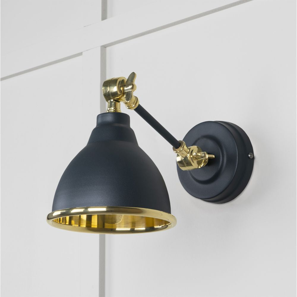 This is an image showing From The Anvil - Smooth Brass Brindley Wall Light in Soot available from trade door handles, quick delivery and discounted prices