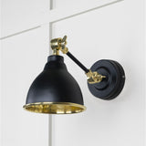 This is an image showing From The Anvil - Hammered Brass Brindley Wall Light in Elan Black available from trade door handles, quick delivery and discounted prices