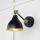 This is an image showing From The Anvil - Hammered Brass Brindley Wall Light in Elan Black available from trade door handles, quick delivery and discounted prices