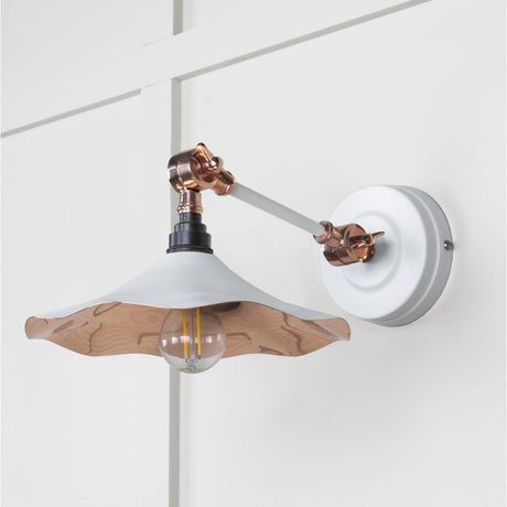 This is an image showing From The Anvil - Smooth Copper Flora Wall Light in Flock available from trade door handles, quick delivery and discounted prices