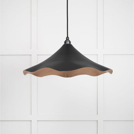 This is an image showing From The Anvil - Smooth Copper Flora Pendant in Elan Black available from trade door handles, quick delivery and discounted prices