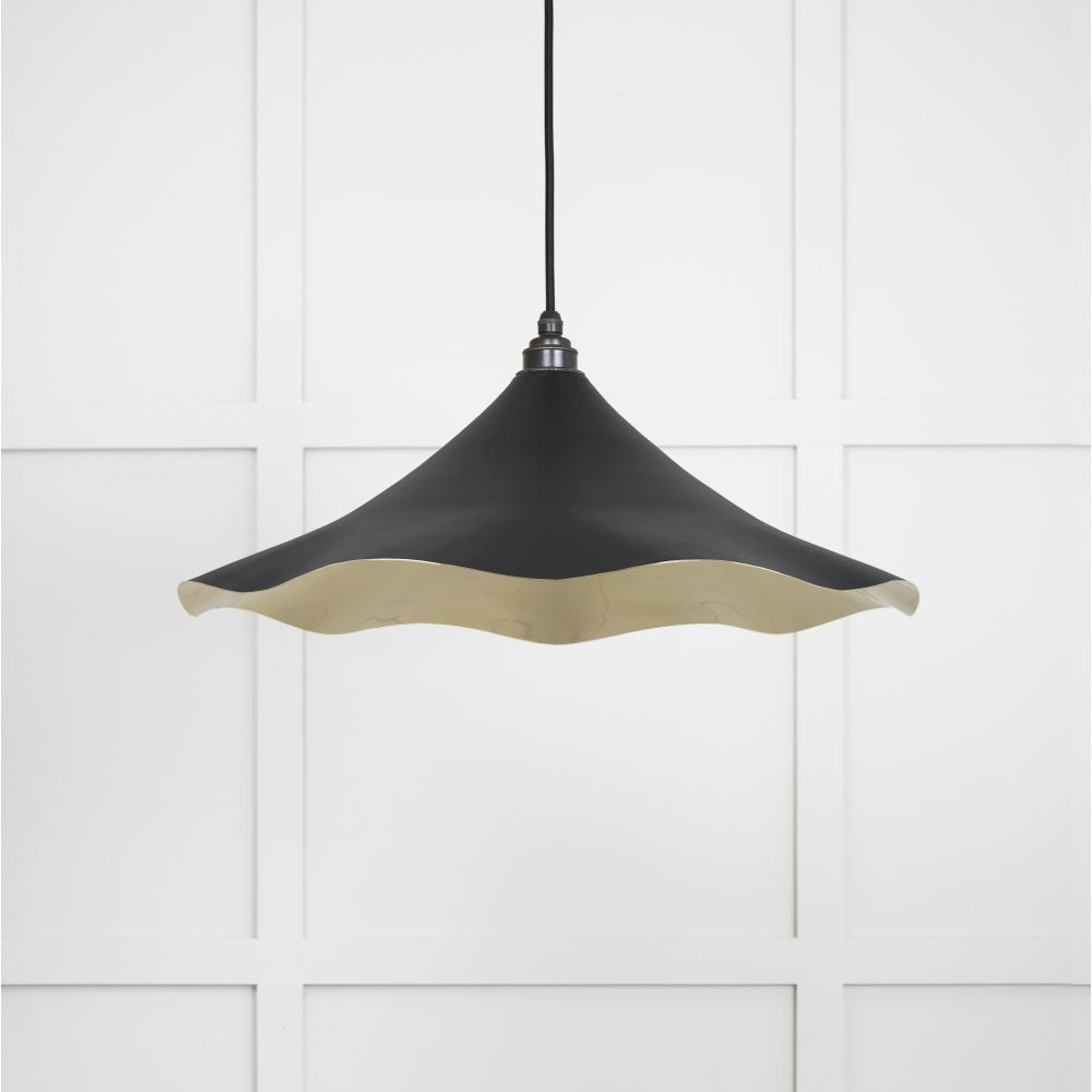 This is an image showing From The Anvil - Smooth Brass Flora Pendant in Elan Black available from trade door handles, quick delivery and discounted prices