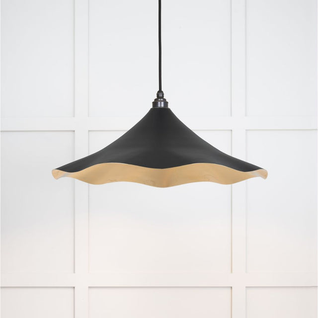 This is an image showing From The Anvil - Smooth Brass Flora Pendant in Elan Black available from trade door handles, quick delivery and discounted prices