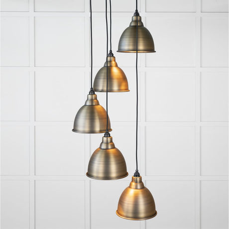 This is an image showing From The Anvil - Aged Brass Brindley Cluster Pendant available from trade door handles, quick delivery and discounted prices