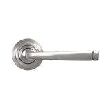 This is an image showing From The Anvil - Satin Marine SS (316) Avon Round Lever on Rose Set (Art Deco) available from trade door handles, quick delivery and discounted prices