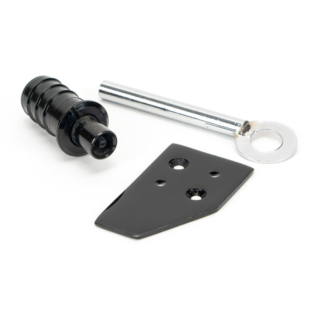 This is an image showing From The Anvil - Black Key-Flush Sash Stop available from trade door handles, quick delivery and discounted prices