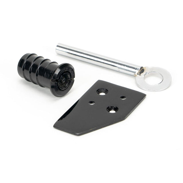 This is an image showing From The Anvil - Black Key-Flush Sash Stop available from trade door handles, quick delivery and discounted prices