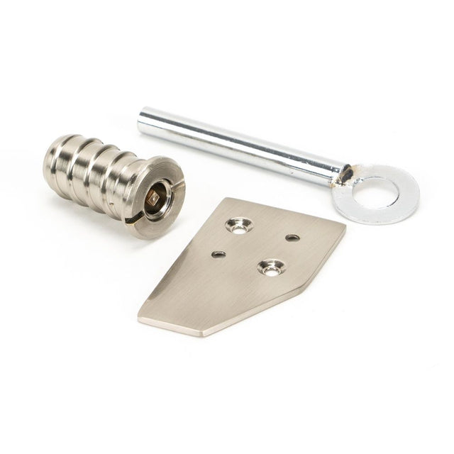 This is an image showing From The Anvil - Polished Nickel Key-Flush Sash Stop available from trade door handles, quick delivery and discounted prices