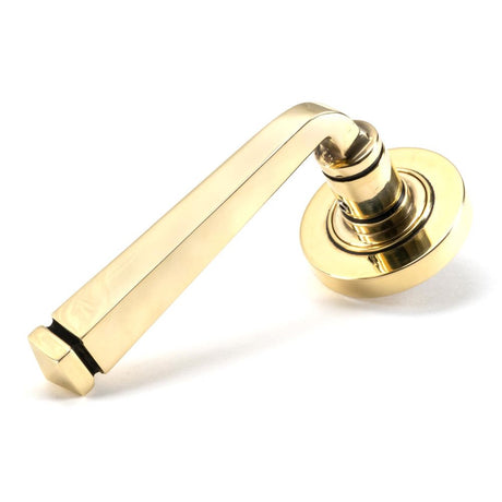 This is an image showing From The Anvil - Aged Brass Avon Round Lever on Rose Set (Plain) - Unsprung available from trade door handles, quick delivery and discounted prices