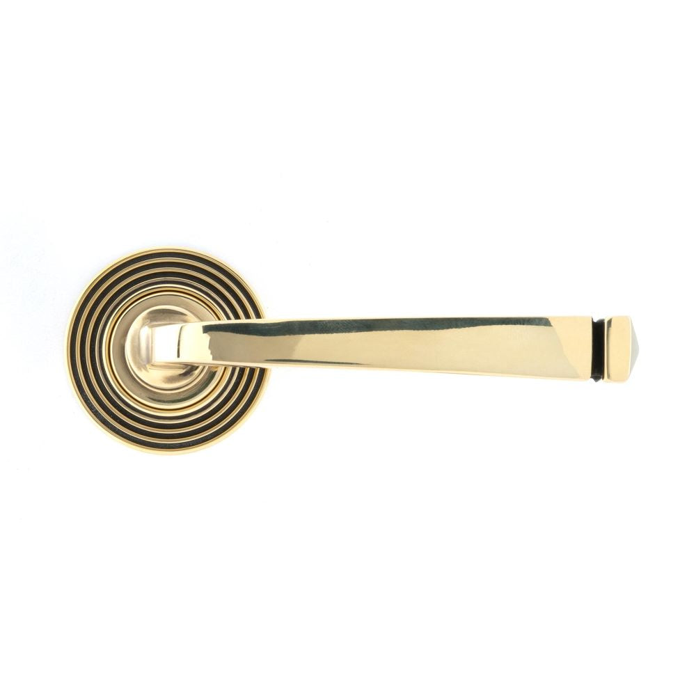 This is an image showing From The Anvil - Aged Brass Avon Round Lever on Rose Set (Beehive) - Unsprung available from trade door handles, quick delivery and discounted prices