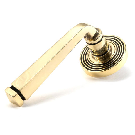 This is an image showing From The Anvil - Aged Brass Avon Round Lever on Rose Set (Beehive) - Unsprung available from trade door handles, quick delivery and discounted prices