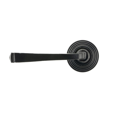 This is an image showing From The Anvil - Black Avon Round Lever on Rose Set (Beehive) - Unsprung available from trade door handles, quick delivery and discounted prices