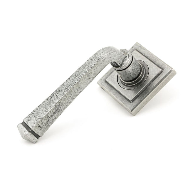 This is an image showing From The Anvil - Pewter Avon Round Lever on Rose Set (Square) - Unsprung available from trade door handles, quick delivery and discounted prices