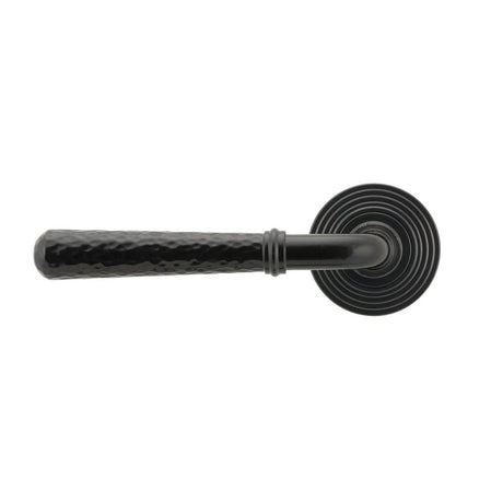 This is an image showing From The Anvil - Black Hammered Newbury Lever on Rose Set (Beehive) - Unsprung available from trade door handles, quick delivery and discounted prices