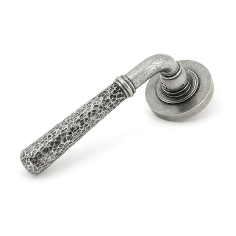 This is an image showing From The Anvil - Pewter Hammered Newbury Lever on Rose Set (Plain) - Unsprung available from trade door handles, quick delivery and discounted prices