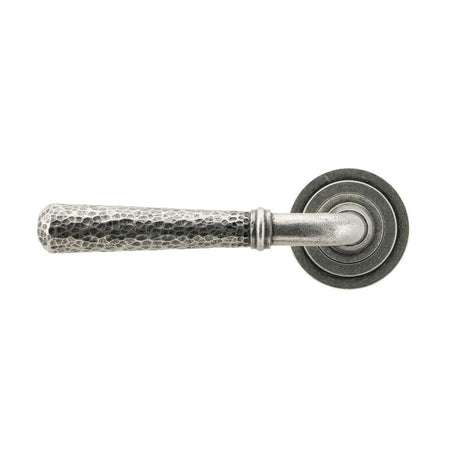 This is an image showing From The Anvil - Pewter Hammered Newbury Lever on Rose Set (Art Deco) - Unsprung available from trade door handles, quick delivery and discounted prices