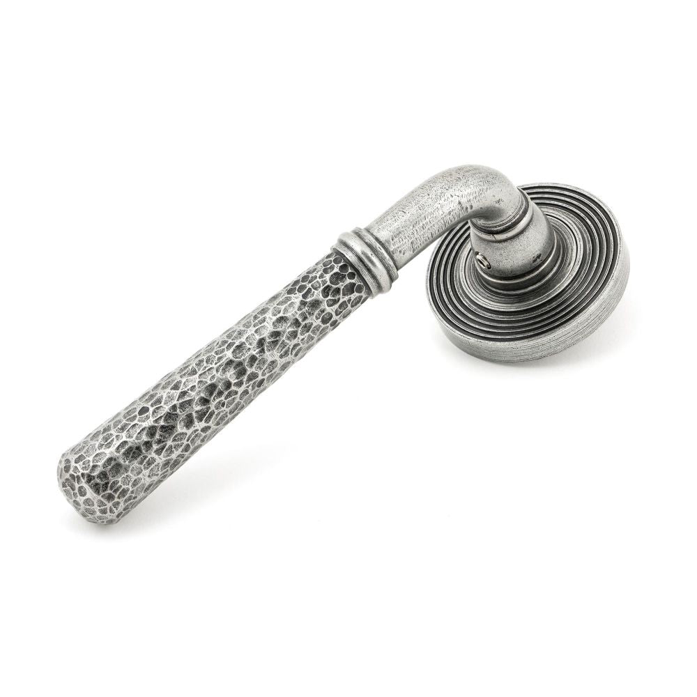 This is an image showing From The Anvil - Pewter Hammered Newbury Lever on Rose Set (Beehive) - Unsprung available from trade door handles, quick delivery and discounted prices