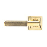 This is an image showing From The Anvil - Aged Brass Brompton Lever on Rose Set (Square) - Unsprung available from trade door handles, quick delivery and discounted prices