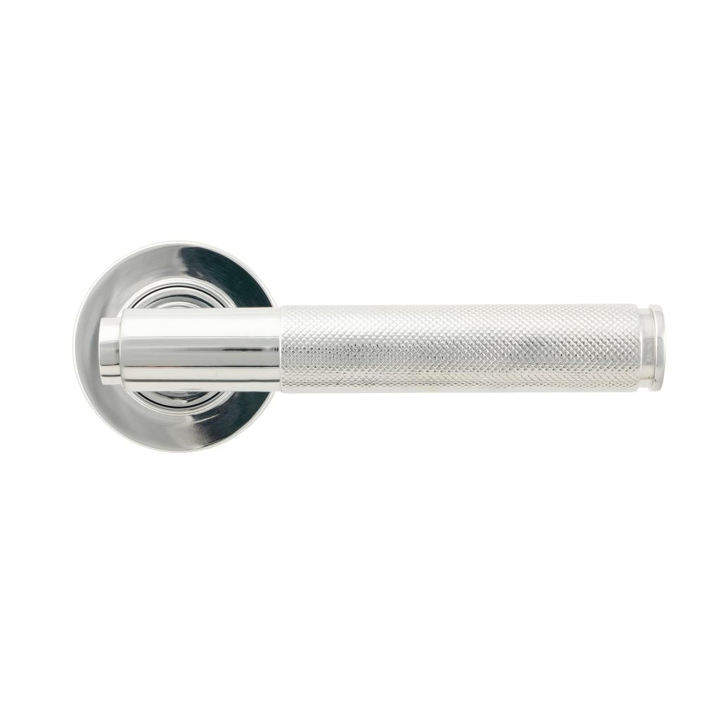 This is an image showing From The Anvil - Polished Chrome Brompton Lever on Rose Set (Plain) - Unsprung available from trade door handles, quick delivery and discounted prices