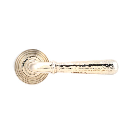 This is an image showing From The Anvil - Pol. Nickel Hammered Newbury Lever on Rose Set (Beehive) - Unsp available from trade door handles, quick delivery and discounted prices