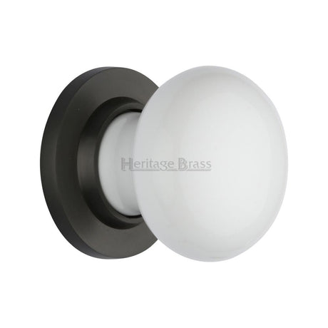 This is an image of a Heritage Brass - White Knob with Matt Bronze base, 5010-mb that is available to order from Trade Door Handles in Kendal.