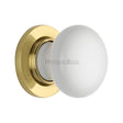 This is an image of a Heritage Brass - White Knob with Polished Brass base, 5010-pb that is available to order from Trade Door Handles in Kendal.