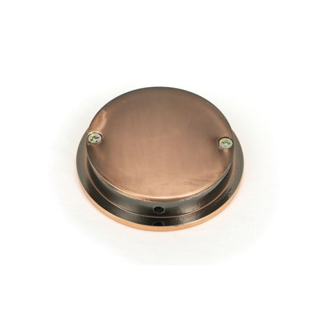 This is an image showing From The Anvil - Polished Bronze 60mm Plain Round Pull available from trade door handles, quick delivery and discounted prices