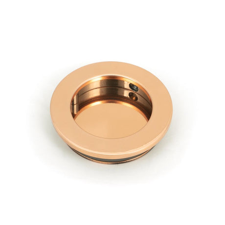 This is an image showing From The Anvil - Polished Bronze 60mm Plain Round Pull available from trade door handles, quick delivery and discounted prices