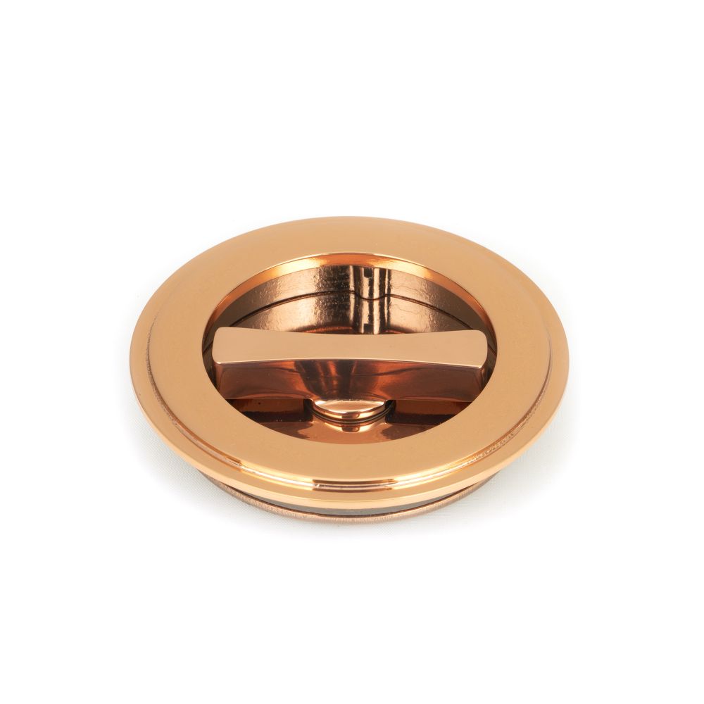 This is an image showing From The Anvil - Polished Bronze 75mm Art Deco Round Pull - Privacy Set available from trade door handles, quick delivery and discounted prices