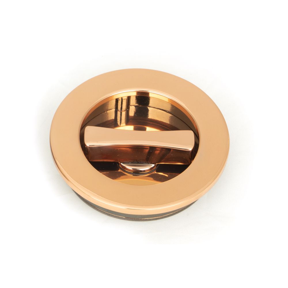 This is an image showing From The Anvil - Polished Bronze 60mm Plain Round Pull - Privacy Set available from trade door handles, quick delivery and discounted prices