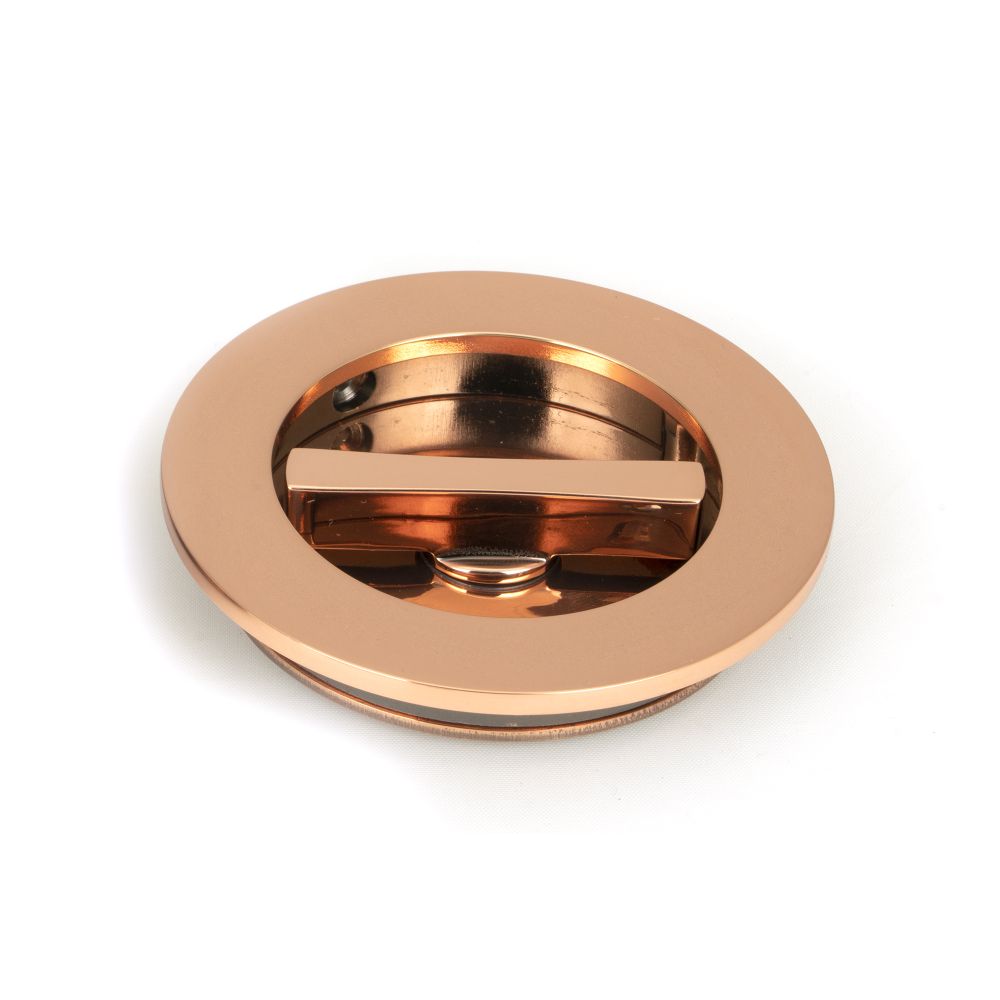 This is an image showing From The Anvil - Polished Bronze 75mm Plain Round Pull - Privacy Set available from trade door handles, quick delivery and discounted prices