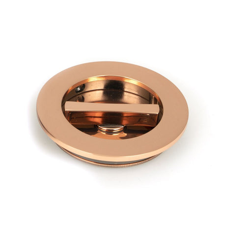 This is an image showing From The Anvil - Polished Bronze 75mm Plain Round Pull - Privacy Set available from trade door handles, quick delivery and discounted prices