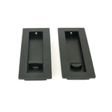 This is an image showing From The Anvil - Matt Black 175mm Plain Rectangular Pull - Privacy Set available from trade door handles, quick delivery and discounted prices