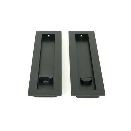 This is an image showing From The Anvil - Matt Black 250mm Plain Rectangular Pull - Privacy Set available from trade door handles, quick delivery and discounted prices