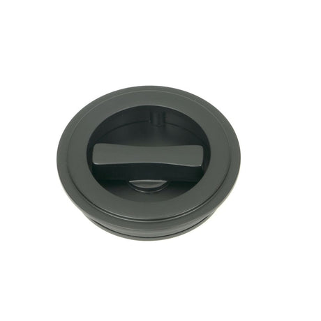 This is an image showing From The Anvil - Matt Black 60mm Art Deco Round Pull - Privacy Set available from trade door handles, quick delivery and discounted prices