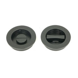 This is an image showing From The Anvil - Matt Black 60mm Plain Round Pull - Privacy Set available from trade door handles, quick delivery and discounted prices