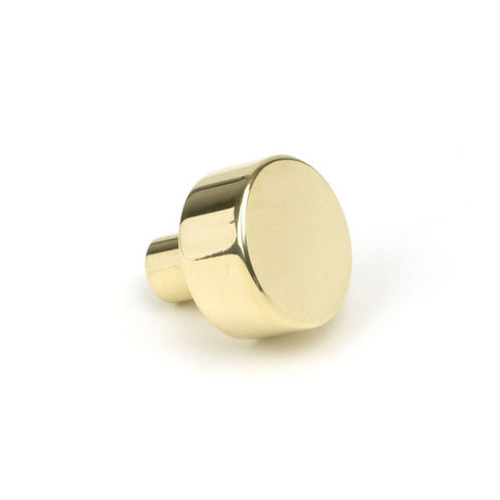 This is an image showing From The Anvil - Polished Brass Kelso Cabinet Knob - 25mm (No Rose) available from trade door handles, quick delivery and discounted prices