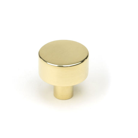 This is an image showing From The Anvil - Polished Brass Kelso Cabinet Knob - 25mm (No Rose) available from trade door handles, quick delivery and discounted prices