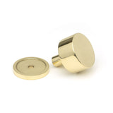 This is an image showing From The Anvil - Polished Brass Kelso Cabinet Knob - 32mm (Plain) available from trade door handles, quick delivery and discounted prices