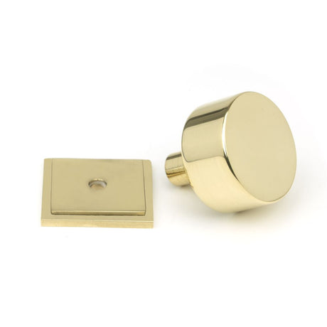 This is an image showing From The Anvil - Polished Brass Kelso Cabinet Knob - 32mm (Square) available from trade door handles, quick delivery and discounted prices