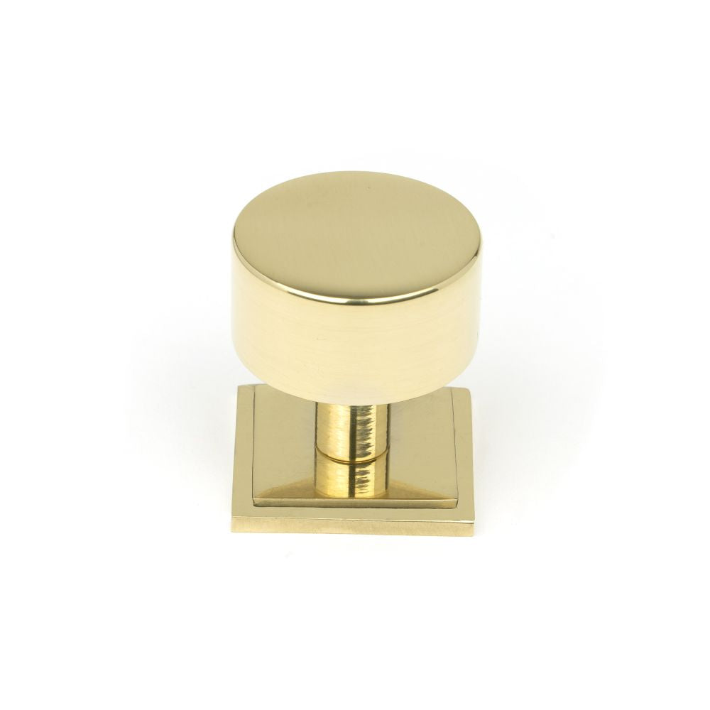 This is an image showing From The Anvil - Polished Brass Kelso Cabinet Knob - 32mm (Square) available from trade door handles, quick delivery and discounted prices