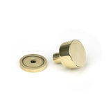 This is an image showing From The Anvil - Aged Brass Kelso Cabinet Knob - 25mm (Plain) available from trade door handles, quick delivery and discounted prices