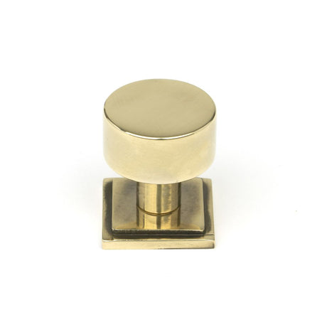 This is an image showing From The Anvil - Aged Brass Kelso Cabinet Knob - 25mm (Square) available from trade door handles, quick delivery and discounted prices