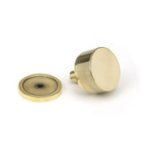 This is an image showing From The Anvil - Aged Brass Kelso Cabinet Knob - 32mm (Plain) available from trade door handles, quick delivery and discounted prices