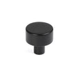 This is an image showing From The Anvil - Matt Black Kelso Cabinet Knob - 25mm (No rose) available from trade door handles, quick delivery and discounted prices