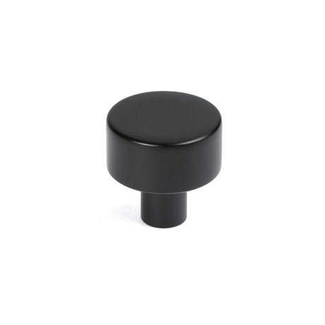 This is an image showing From The Anvil - Matt Black Kelso Cabinet Knob - 25mm (No rose) available from trade door handles, quick delivery and discounted prices