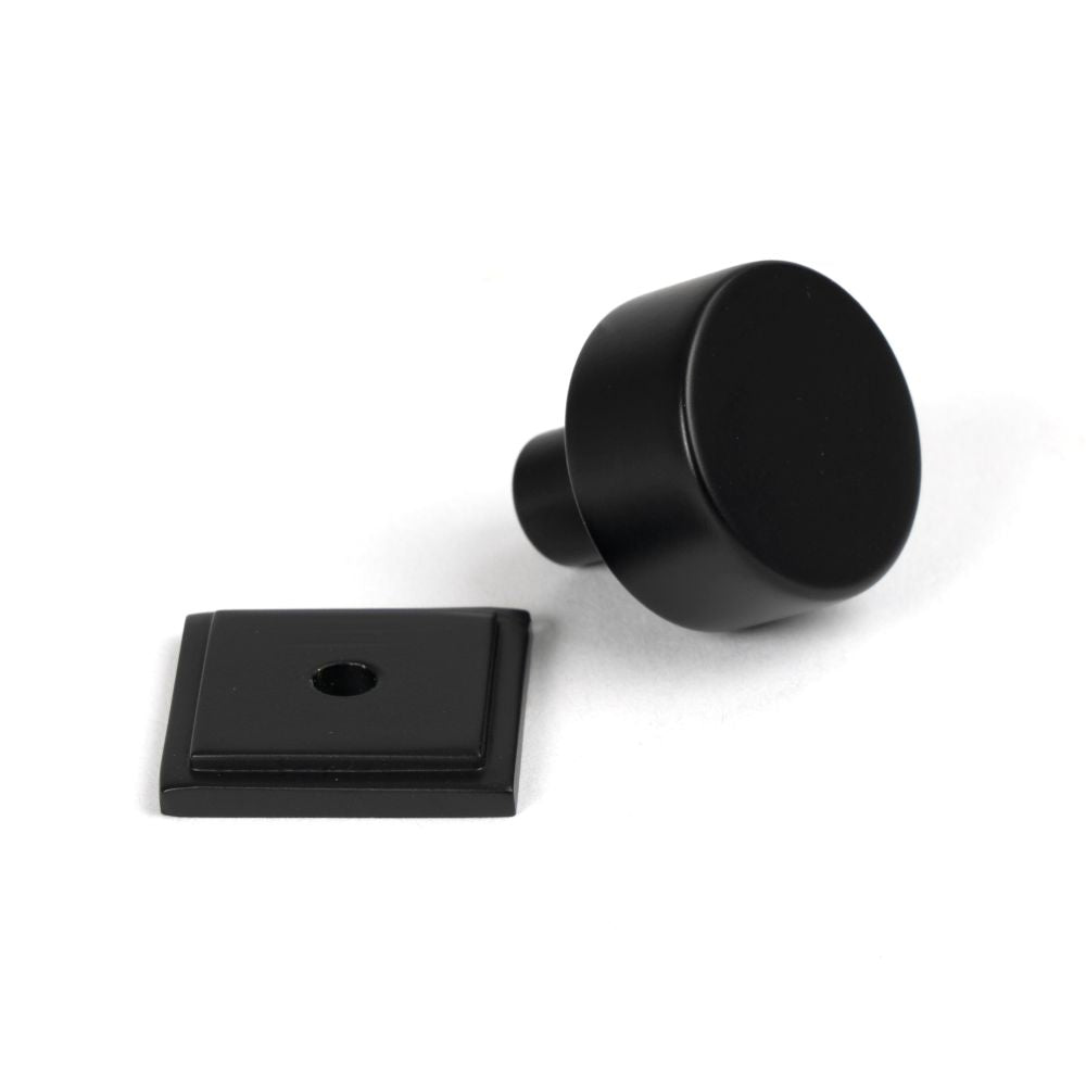 This is an image showing From The Anvil - Matt Black Kelso Cabinet Knob - 25mm (Square) available from trade door handles, quick delivery and discounted prices