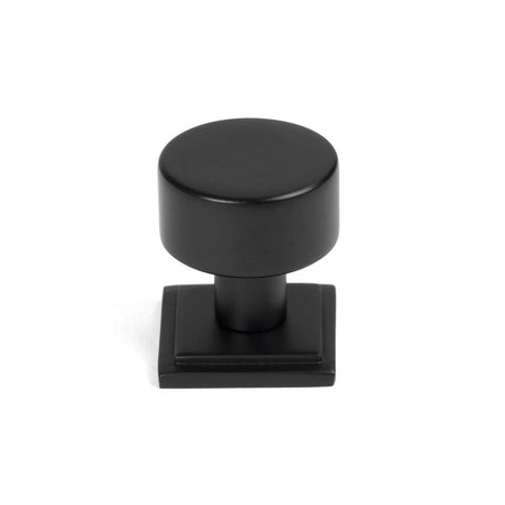 This is an image showing From The Anvil - Matt Black Kelso Cabinet Knob - 25mm (Square) available from trade door handles, quick delivery and discounted prices