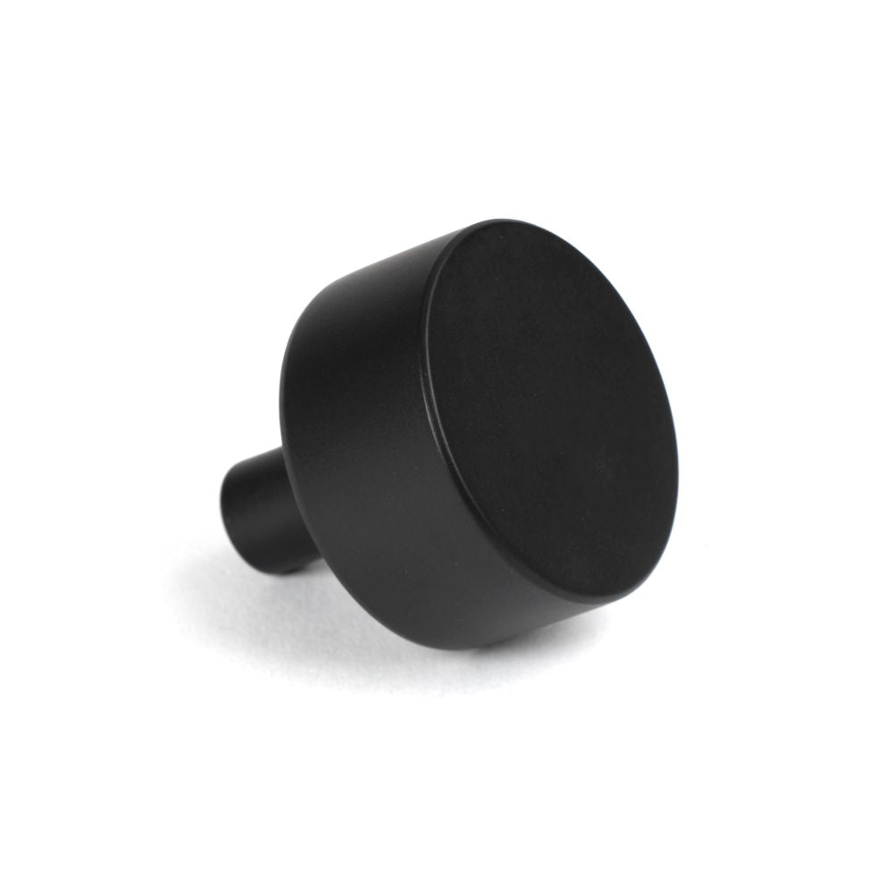 This is an image showing From The Anvil - Matt Black Kelso Cabinet Knob - 32mm (No rose) available from trade door handles, quick delivery and discounted prices